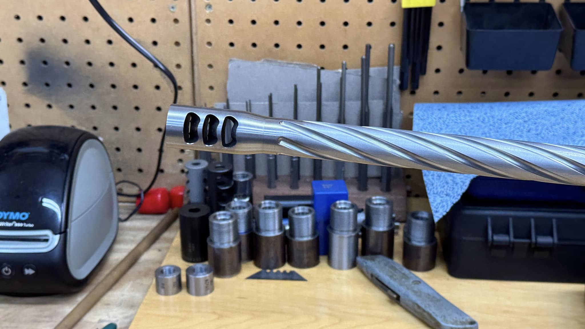 Muzzle brake blended into barrel profile for smooth transition and better aesthetics